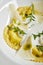 Exquisite Serving White Restaurant Plate of Ravioli 4 Cheeses with Cheese Espoume Close Up. Traditional Delicacy Italian Dumplings