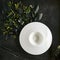 Exquisite serving white restaurant plate template on natural dark stone