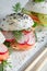 Exquisite sushi burger with rice and seafood sprinkled with sesame