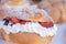 Exquisite traditional Mexican bread filled with whipped cream and red fruits, Mexican style