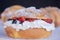 Exquisite traditional Mexican bread filled with whipped cream and red fruits, Mexican style