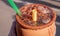 Exquisite traditional Mexican jarritos from Jalisco with lemon soda, tequila, tamarind and ice with a straw on top