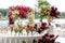 Exquisitely arranged and decorated wedding table outdoors on your wedding day. Beautiful flowers on the table on the wedding day.