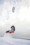 Exteme snow kite jump.