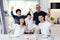 Extended Asian family of three generations having a meal together and showing thumbs up at home with happiness