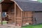 Exterior of an adorable camping cabin with a porch swing and window at a campground in rural America