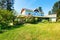 Exterior of American country house with nice landscape.