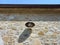 Exterior antique lamp on stone facade. Bottom view of vintage iron lantern. Architecture and construction