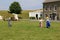 Exterior architecture of historic buildings and children playing, Fort Ontario, New York, 2016