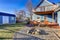 Exterior of blue craftsman house with covered back porch, fire p