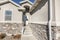 Exterior of a concrete bungalow house with stone bricks siding