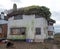 Exterior of derelict house built in 1930s deco style, Rayners Lane, Harrow UK