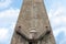 Exterior detail of antique tower building in Florence, Italy, with Escher architecture style