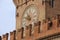 Exterior detail of the Clock Tower at Palazzo Comunale in Bologna, Italy.