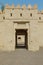Exterior and entrance gate of the Al Jahili Fort in Al Ain, Abu Dhabi, United Arab Emirates