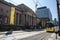 Exterior facade of Manchester Art Gallery with street outside and iconic yellow metrolink tram