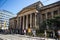 Exterior facade of Manchester Art Gallery with street outside and people walking past