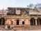 The exterior facade of a mandapa hall in the ancient Hindu temple complex of