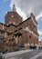 Exterior facade of the Pavia Cathedral in Lombardy, Italy with sturdy brown walls