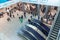 Exterior glass lobby of the new underground railway station in Jerusalem People ride the escalator during rush hour