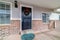 Exterior of house on a sunny neighborhood with christmas wreath on front door