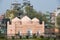 Exterior of the Lalbagh Fort Mosque with residential buildings at the background in Dhaka, Bangladesh.