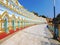 The exterior of the long and slightly curved Buddha gallery at the U Min Thonze Temple in Sagaing, Burma.