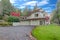 Exterior of a luxury home. View of garage spaces and driveway