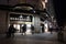 Exterior Night Shot of Illuminated entrance to Debenhams Department Store with Patisserie Valerie sign
