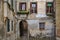 Exterior of an old building with shutters and an archway in Venice Italy