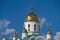 Exterior of the Orthodox Church, Golden domes and crosses, white walls, bright light and blue sky