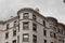 Exterior outside corner of painted brick apartment building featuring beautiful moulding details