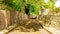 Exterior passageway of Graveyard Abbey with tombstones resting on the walls in the village of Athlone