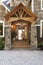 Exterior porch and front door entrance to beautiful, upscale country house with high quality wood and stone building materials