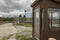 Exterior of prison guard house with overgrown yard