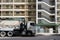 Exterior of a public housing building with a truck on the street in Wah Fu Estate