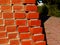 exterior red clay brick wall corner with steps and ledges