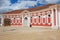 Exterior of the red painted stables building next to Rundale palace in Pilsrundale, Latvia.