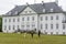 The exterior of the Royal Marselisborg Palace, People visit the garden around the castle