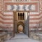 Exterior shot of entrance of Al-Muayyad Bimaristan historic hospital building, Darb Al Labana district, Old Cairo, Egypt