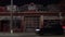 Exterior shot of Garage.Night in city.