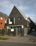 Exterior of small contemporary dark grey brick house. Steep pitched roof. Modern designer minimalist home dwelling architecture