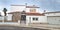 The exterior of a small private residential building in the Mediterranean style on the street of the resort village. Rental