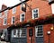 The exterior of a traditional Enhlish pub.