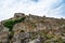 Exterior view of the ancient stone walls of the Rozafa Castle in Shkoder Albania. The dilapidated facade of a medieval fortress