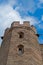 Exterior view of an antique medieval English castle tower facade from below