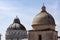 Exterior view of the Baptistery and cathedral cupolas in Pisa Liguria Italy on April 18, 2019