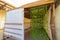 Exterior view of a decorated sukkah, before Sukkot