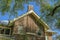 Exterior view of a house with red brick wall and gable roof in San Antonio Texas