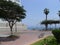 Exterior view of a modern white and beige residential building facing the Pacific Ocean in Barranco district of Lima